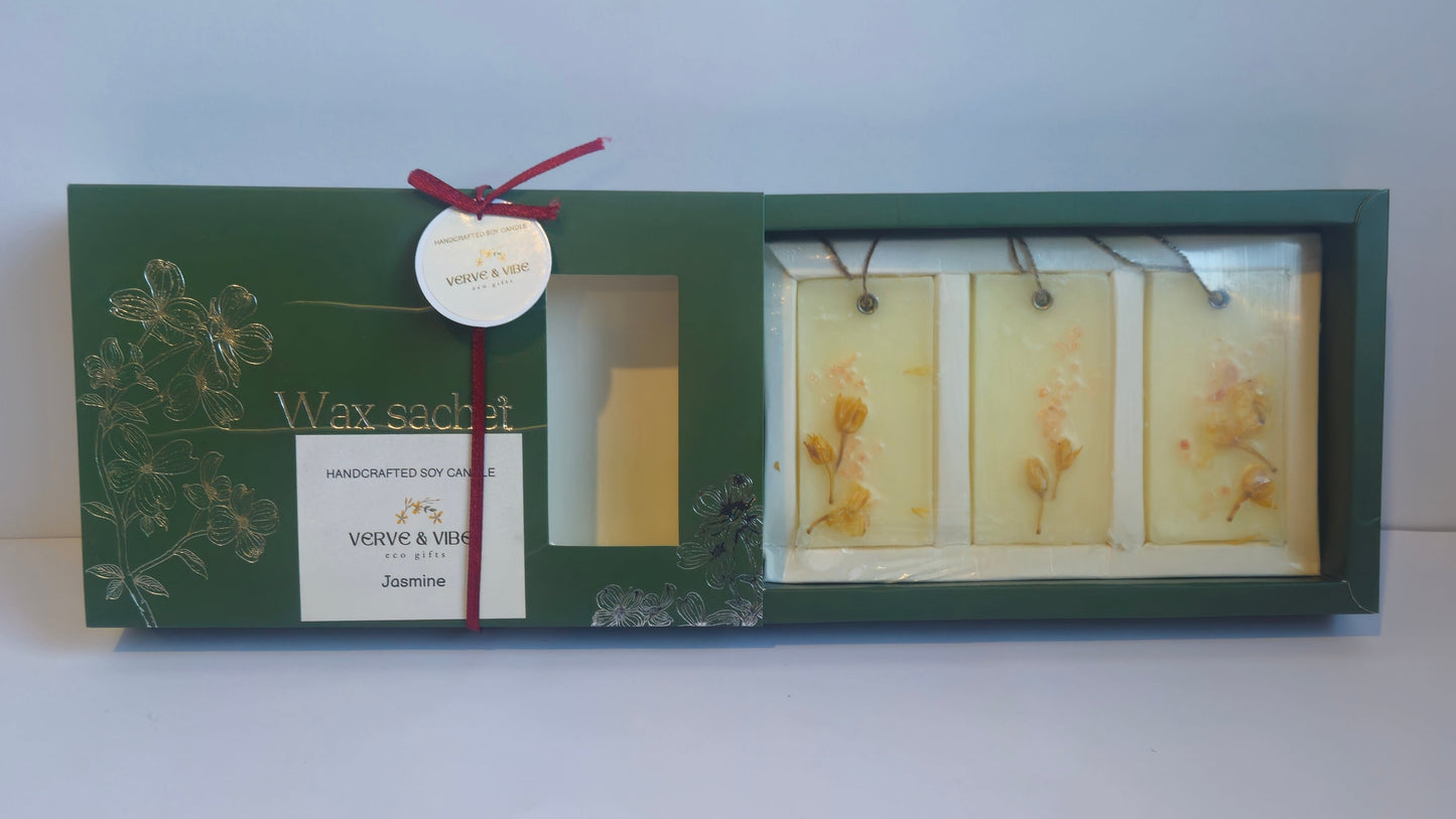Set of three framed prints with a green border and red ribbon on a white surface.