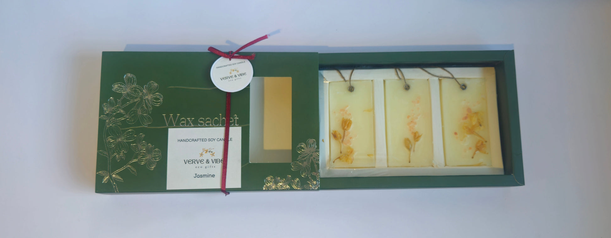 Packaged product with green box and yellow labels on a white surface