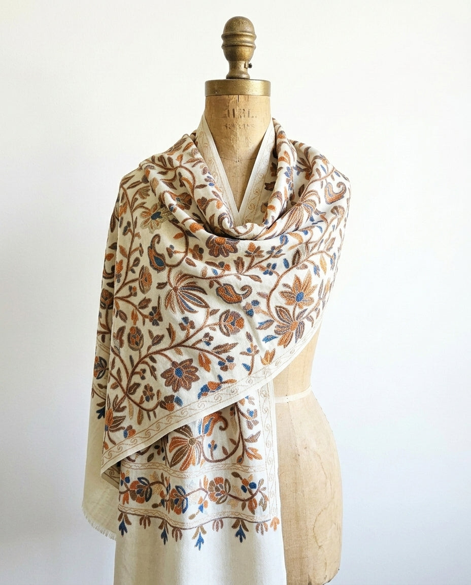 Floral patterned scarf on a mannequin against a white background