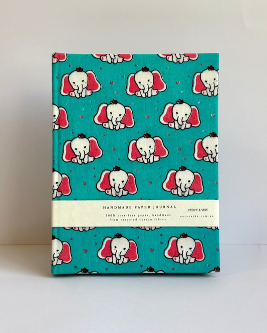 Journal with elephant pattern on a teal background