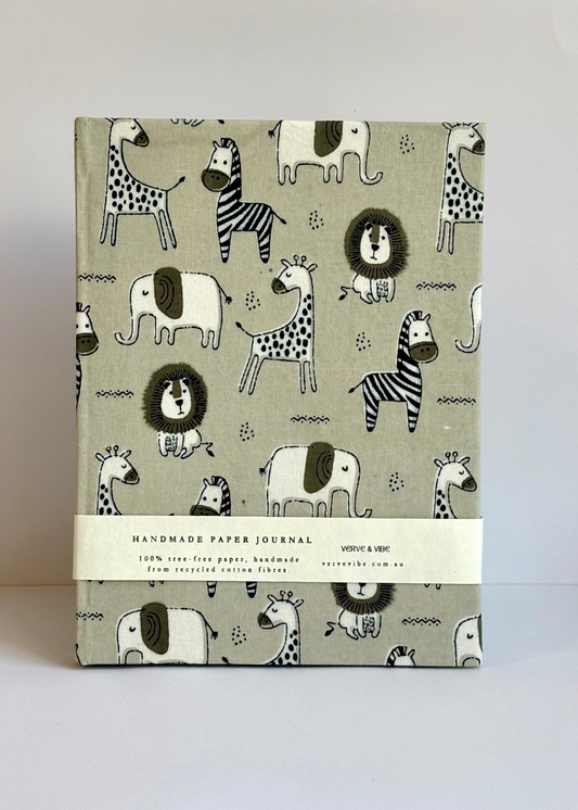 Handmade paper journal with animal pattern on a light gray background