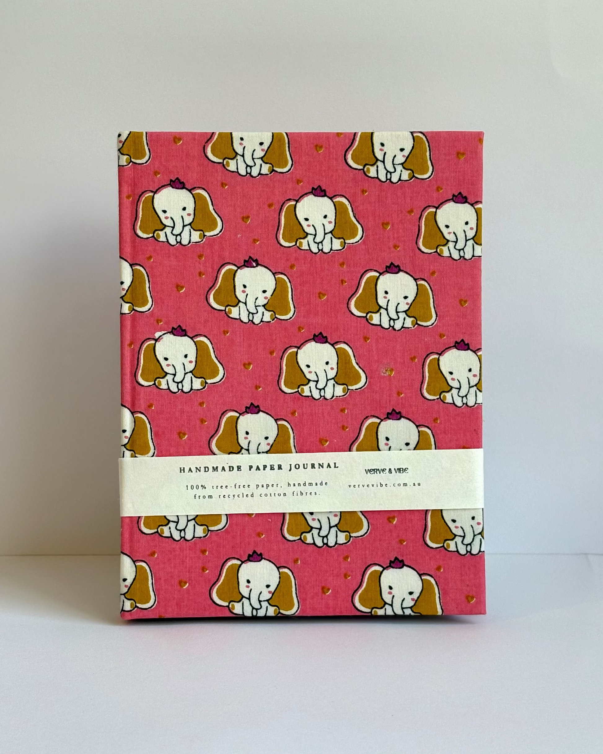 Handmade paper journal with elephant pattern on a pink background