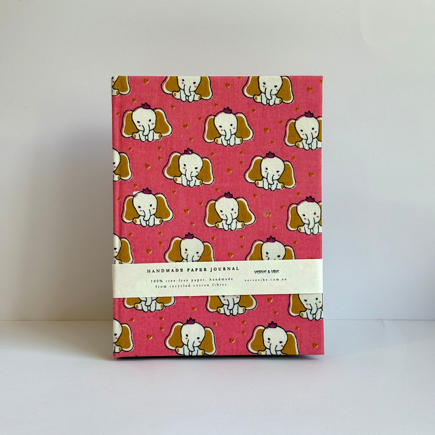 Notebook with a pink cover featuring cartoon elephants on a white background