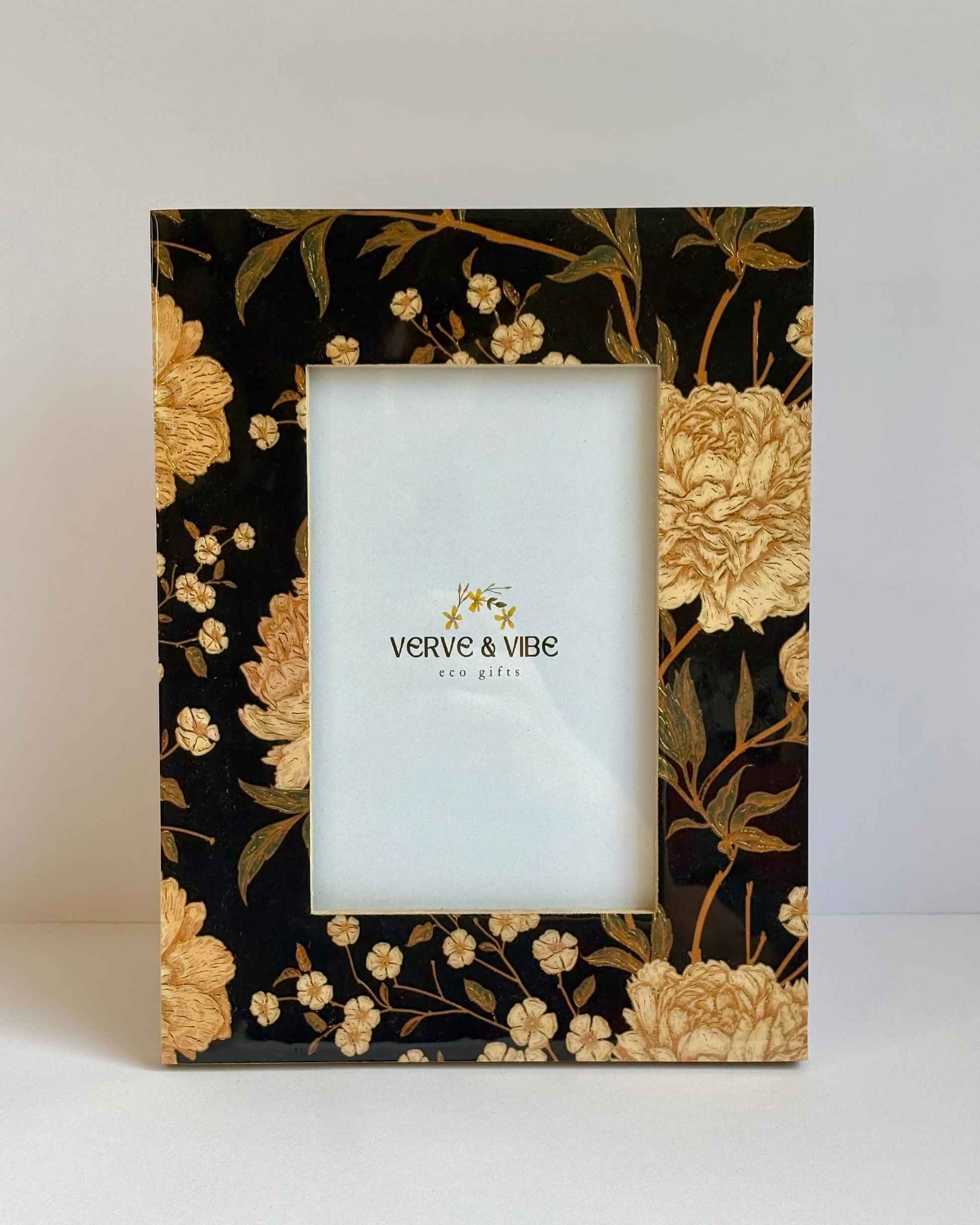 Floral photo frame with 'Verve & Vibe' branding on a white background