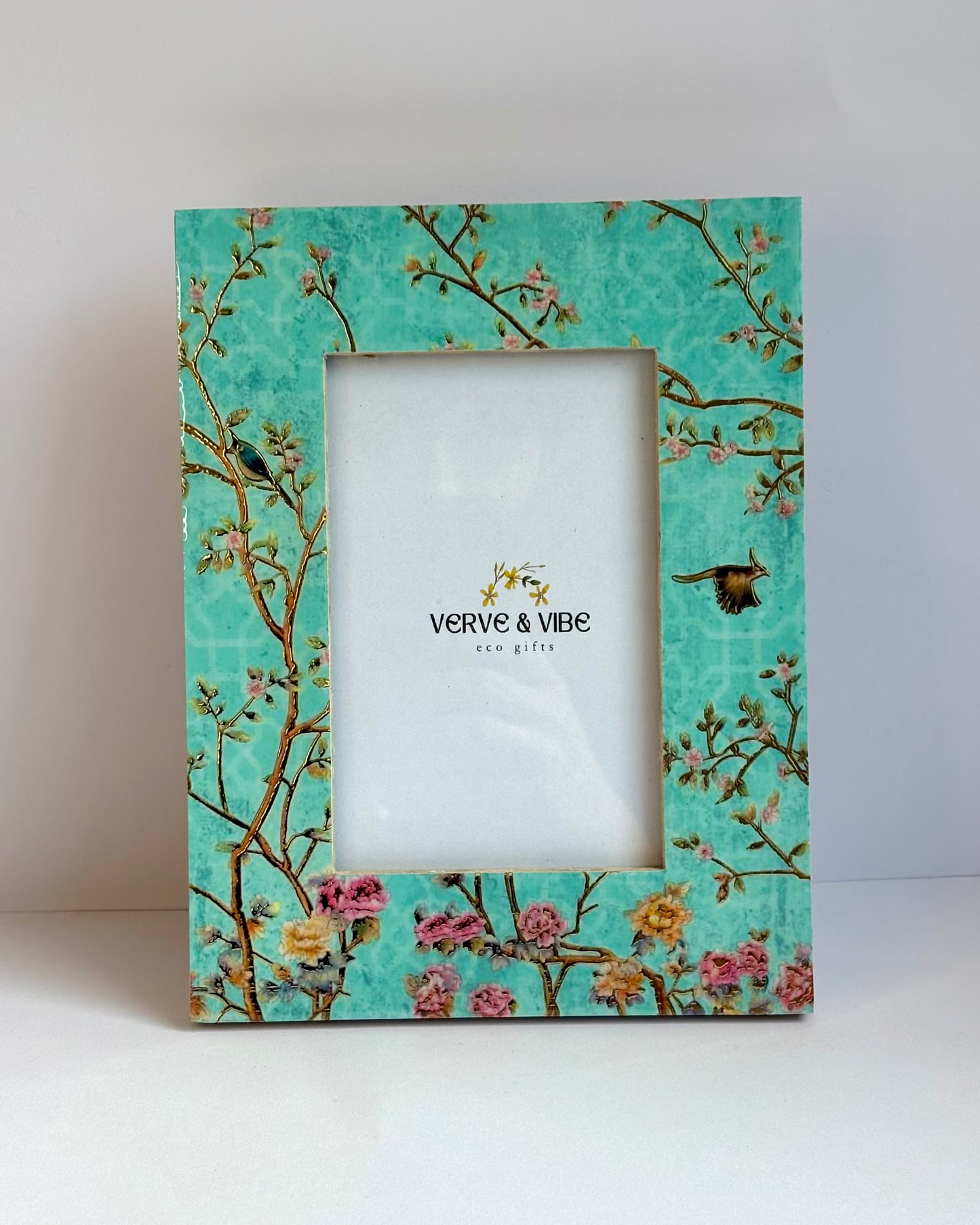 Decorative photo frame with floral design on a white background
