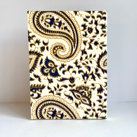Notebook with blue paisley pattern on a white background