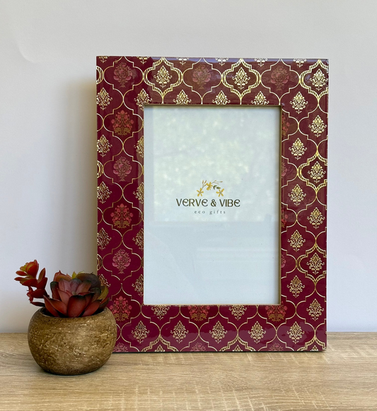 Decorative photo frame with gold patterns on a white background, featuring the brand 'Verve & Vibe'.