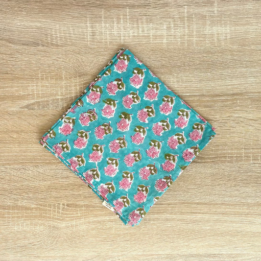 Floral patterned pouch on a wooden surface