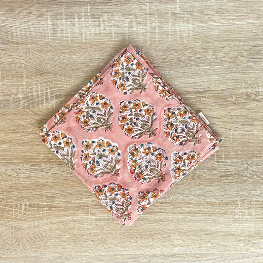 Floral patterned pouch on a wooden surface