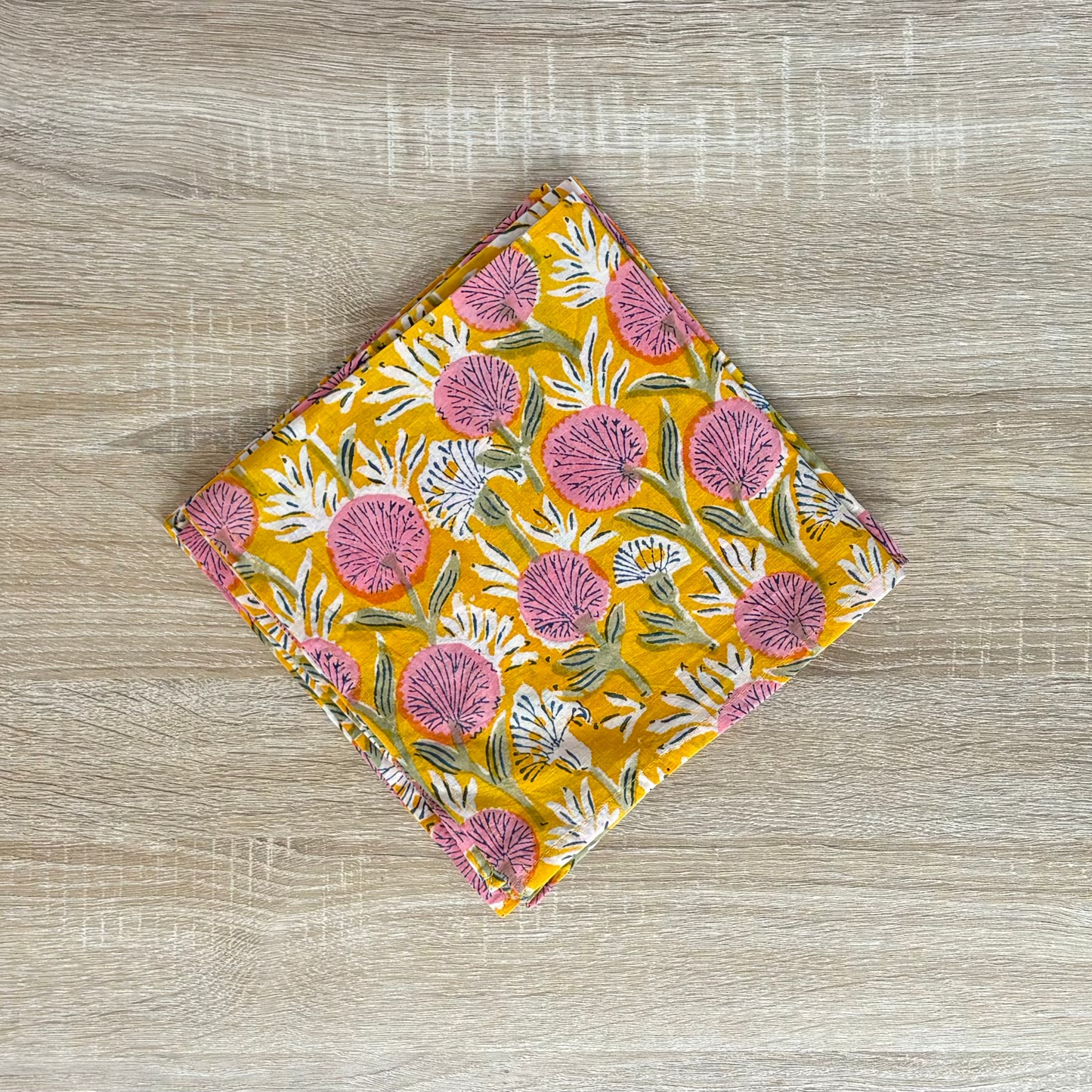Floral patterned fabric on a wooden surface