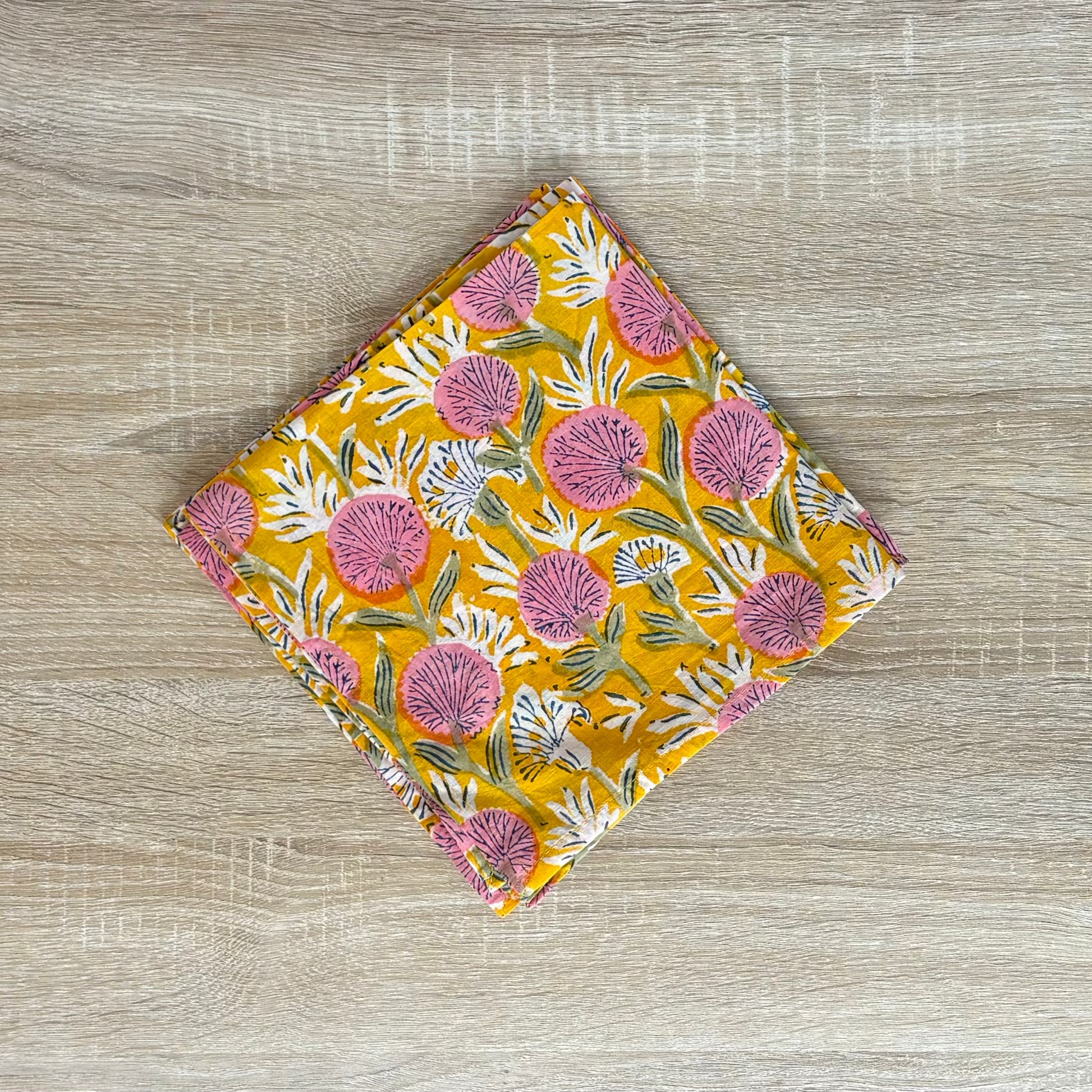 Floral patterned fabric on a wooden surface