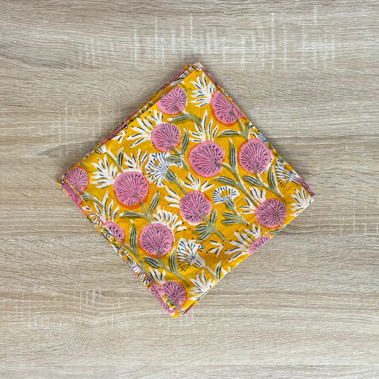 Floral patterned fabric on a wooden surface
