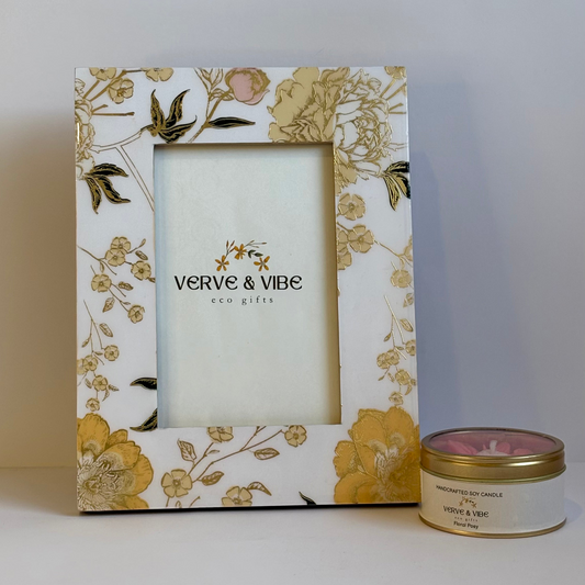 Floral photo frame with 'Verve & Vibe' branding next to a candle on a white background