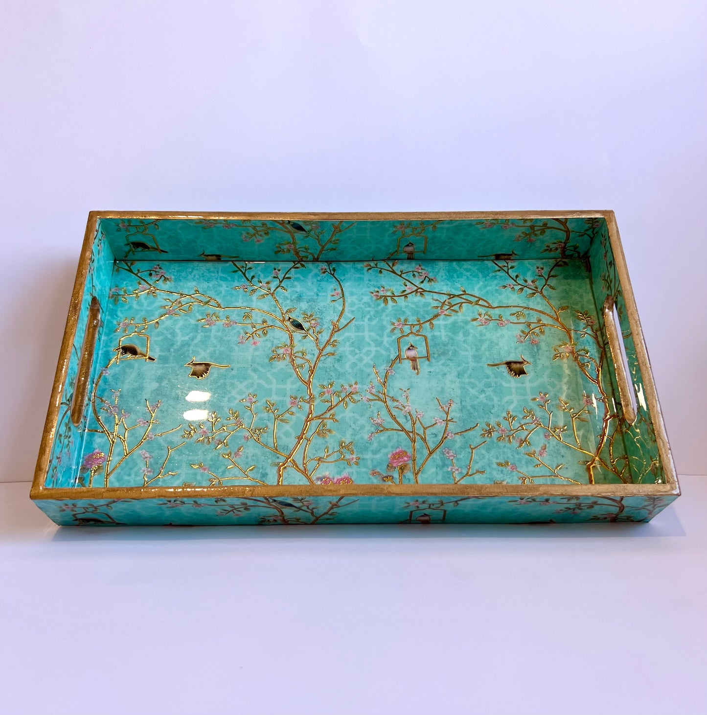 Decorative tray with floral and bird design on a white background