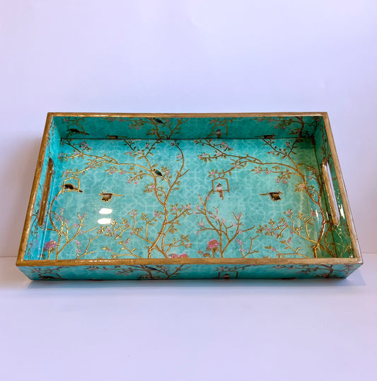 Decorative tray with floral and bird design on a white background