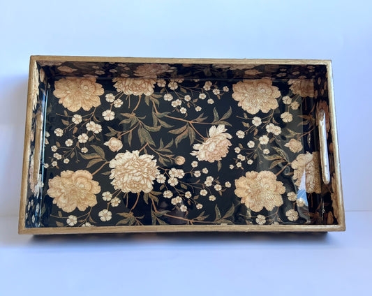 Decorative tray with floral pattern on a white background