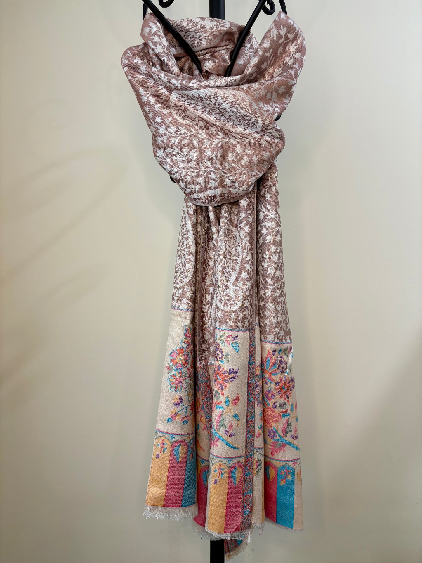 Decorative scarf with floral patterns on a plain background